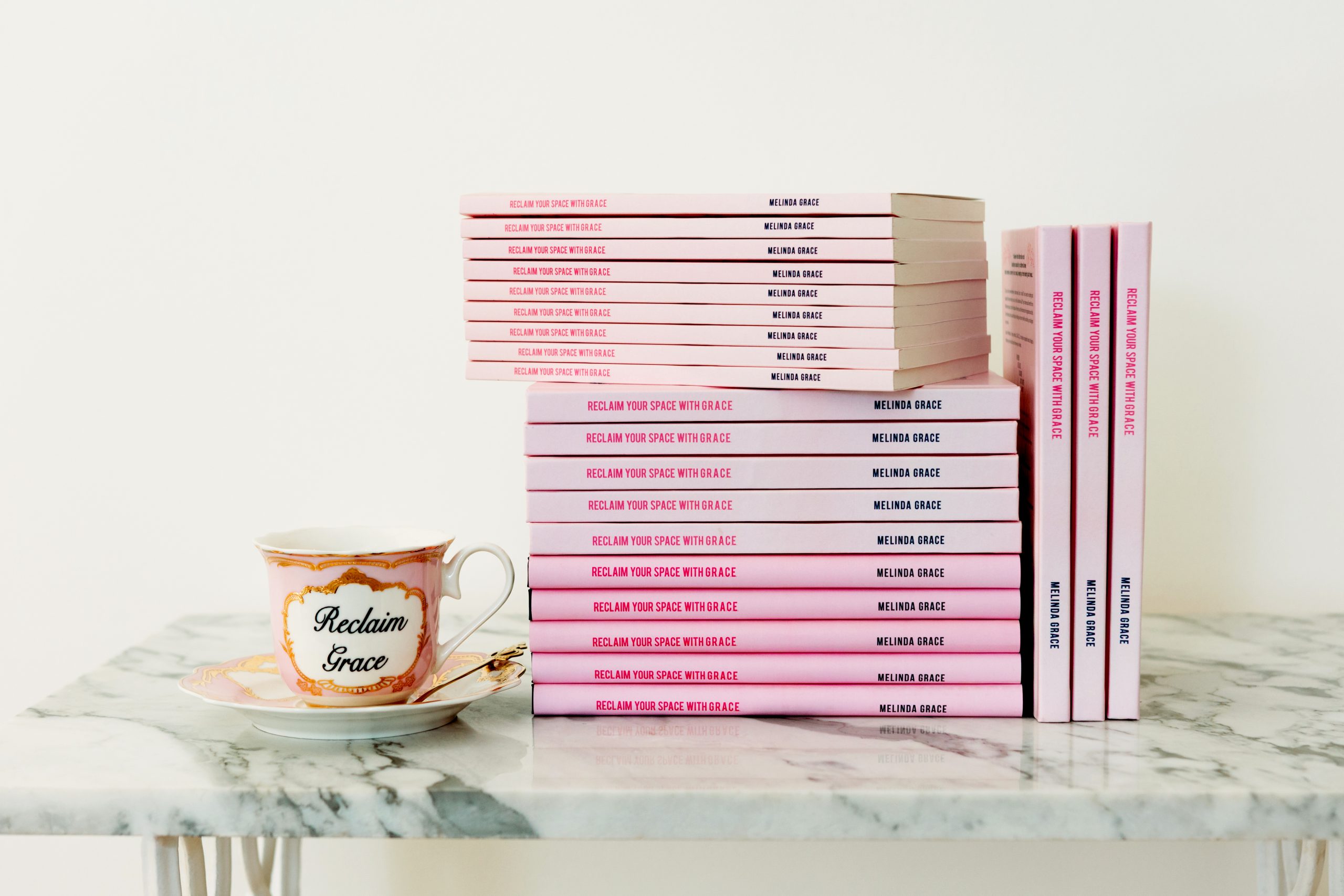 stack of reclaim your space with grace books 